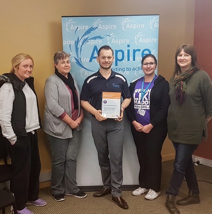 5 staff from Aspire with their Achievement Program certificate for mental health