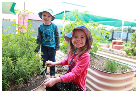 Boy and girl gardening